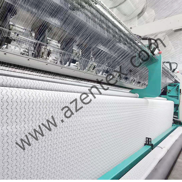 Macchina per pizzo Raschel con piatto jacquard multibarra